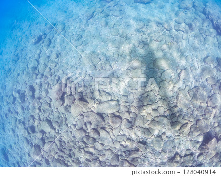 The shadow of a skin diver reflected on the sand in the shallow water. The ripples of the calm sea are beautiful. Hirizohama Nakagi Minamiizu Town Izu Peninsula Shizuoka Prefecture 202 The shadow of a skin diver reflected on the sand in the shallow water. The ripples of the calm sea are beautiful. Hirizohama Nakagi Minamiizu Town Izu Peninsula Shizuoka Prefecture 202 128040914