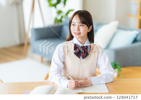 Girls high school studying at home Girls high school studying at home 128041717