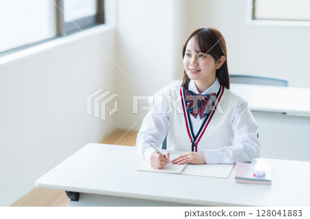 Students studying in classroom 128041883