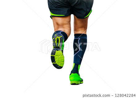 legs runner athlete running marathon in black compression socks cut-out figure on white background legs runner athlete running marathon in black compression socks cut-out figure on white background 128042284