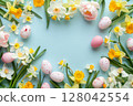 Spring daffodils and tulips with Easter eggs on pastel blue background 128042554