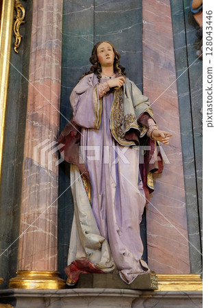 Saint Apollonia statue at the altar in the church of Saint Catherine of Alexandria in Krapina, Croatia 128043446