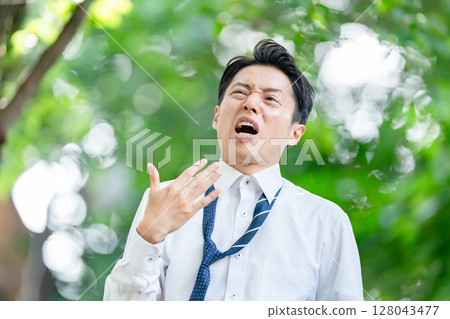 Businessman, extreme heat, heat stroke, abnormal weather Businessman, extreme heat, heat stroke, abnormal weather 128043477