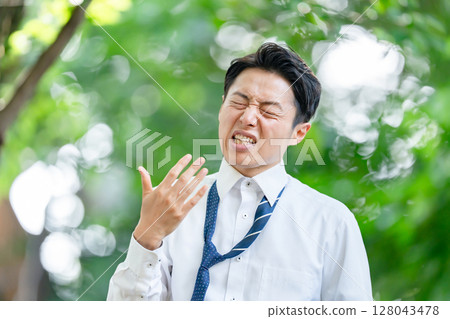 Businessman, extreme heat, heat stroke, abnormal weather Businessman, extreme heat, heat stroke, abnormal weather 128043478