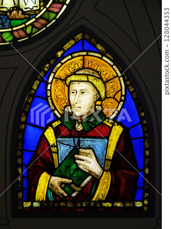 Deacon stained glass window by Pacino di Buonaguida in the Basilica di Santa Croce (Basilica of the Holy Cross) - famous Franciscan church in Florence, Italy 128044353