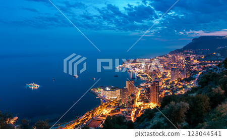 Aerial top view of Monaco from the grand corniche road day to night timelapse, Monaco France 128044541