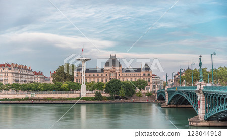 Panoramic hyperlapse view of the Rhone River and its embankment, featuring the University Jean-Moulin in Lyon, France. 128044918