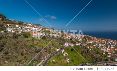 Aerial view from the mountain over the rooftops from cable car on Madeira timelapse hyperlapse. 128044922