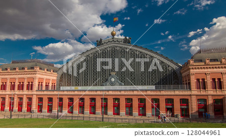 Puerta De Atocha train station building timelapse hyperlapse in Madrid, Spain. 128044961