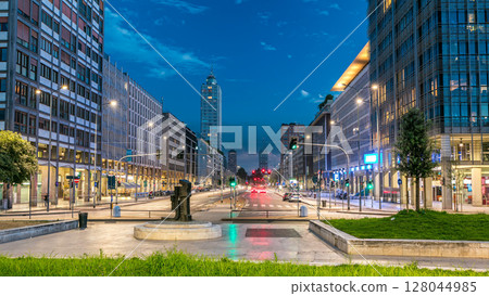 Evening in business part of city Milan located on the Vittor Pisani Street Via Vittor Pisani day to night timelapse 128044985