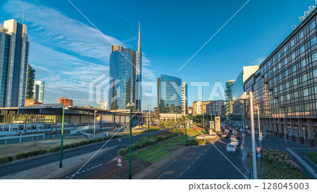 Milan skyline with modern skyscrapers in Porta Nuova business district timelapse hyperlapse in Milan, Italy, at sunset. 128045003