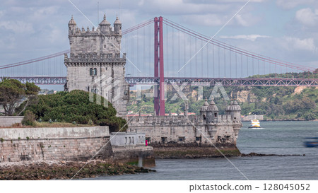 Cityscape with Torre de Belem or Belem Tower and red iconic 25 de Abril Bridge over Tagus river. Lisbon, Portugal. 128045052