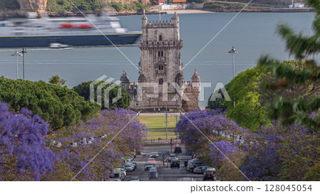 View of Avenida Torre de Belem timelapse, with cars and the Belem Tower in the background. Lisbon, Portugal View of Avenida Torre de Belem timelapse, with cars and the Belem Tower in the background. Lisbon, Portugal 128045054