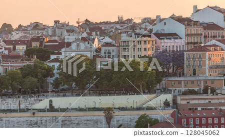 Aerial view over the center of Lisbon to the viewpoint called Miradouro de Sao Pedro de Alcantara timelapse. Portugal Aerial view over the center of Lisbon to the viewpoint called Miradouro de Sao Pedro de Alcantara timelapse. Portugal 128045062