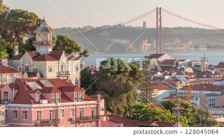 Orange Roofs of houses in Lisbon, Tagus River and Bridge April 25 or Ponte 25 de Abril aerial timelapse from above, Portugal. Orange Roofs of houses in Lisbon, Tagus River and Bridge April 25 or Ponte 25 de Abril aerial timelapse from above, Portugal. 128045064