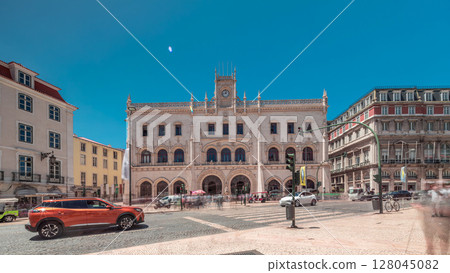 Rossio station in Lisbon timelapse hyperlapse. Front view with zebra crossing and street traffic. Rossio station in Lisbon timelapse hyperlapse. Front view with zebra crossing and street traffic. 128045082