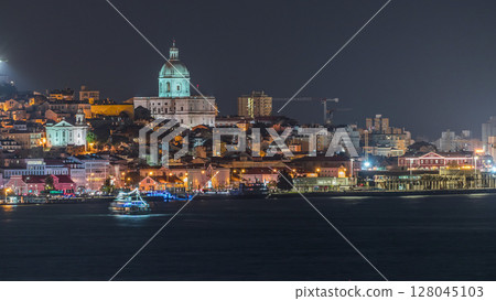 Aerial night timelapse of Lisbon's historic center with the illuminated National Pantheon 128045103