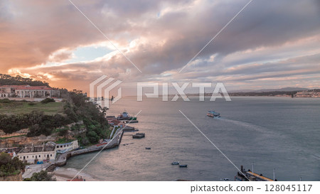 Aerial timelapse from a hill near Porto Brandao Ferry Station on the Tagus River in Lisbon Aerial timelapse from a hill near Porto Brandao Ferry Station on the Tagus River in Lisbon 128045117