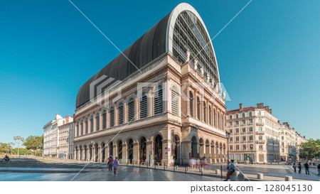 Hyperlapse of Lyon's opera house featuring neoclassical architecture combined with a modern glass dome roof. France 128045130