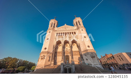Hyperlapse front view of the Basilica of Notre Dame de Fourviere during sunset in Lyon, France. Hyperlapse front view of the Basilica of Notre Dame de Fourviere during sunset in Lyon, France. 128045135