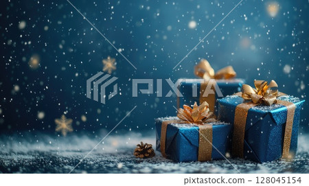 christmas presents on blue snowy winter background 128045154