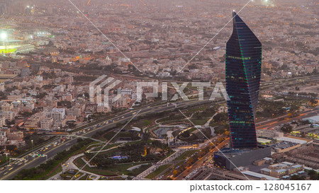 Kuwait City cityscape day to night timelapse is the capital of Kuwait. Sunset time. 128045167