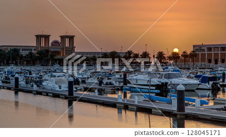 Yachts and boats at the Sharq Marina at sunset timelapse in Kuwait. Kuwait City, Middle East 128045171