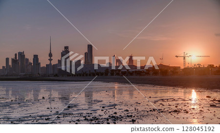Seaside skyline of Kuwait city sunrise timelapse 128045192