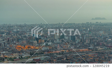 Aerial view of Lima skyline day to night timelapse from San Cristobal hill. 128045219