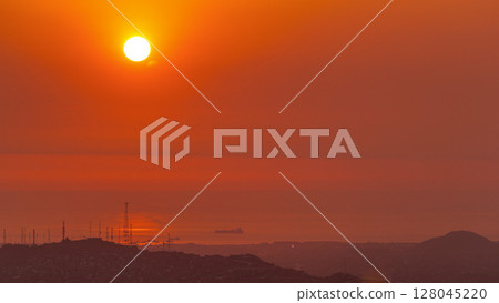 Aerial view of the Pacific ocean during sunset timelapse from Cerro San Cristobal, Lima Aerial view of the Pacific ocean during sunset timelapse from Cerro San Cristobal, Lima 128045220