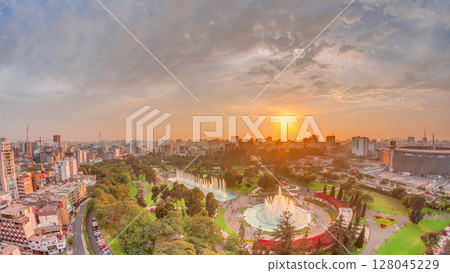 Aerial sunset view to Park of the Reserve with magic water circuit biggest fountain complex timelapse Aerial sunset view to Park of the Reserve with magic water circuit biggest fountain complex timelapse 128045229