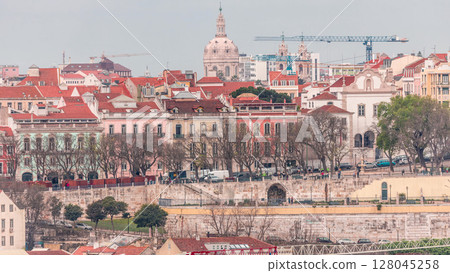 Aerial view over the center of Lisbon to the viewpoint called Miradouro de Sao Pedro de Alcantara timelapse. 128045258