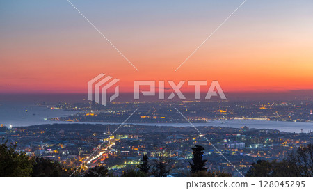 Istanbul classical night skyline scenery day to night timelapse, view over Bosporus channel. 128045295