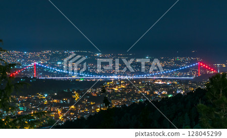Fatih Sultan Mehmet Bridge view, connects Asia and Europe night timelapse from top of Camlyca hill. Istanbul, Turkey 128045299