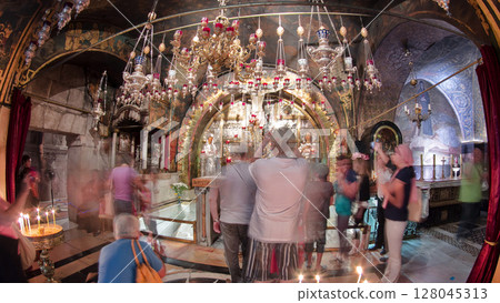 Icons and candles in the Church of the Holy Sepulcher timelapse hyperlapse. 128045313