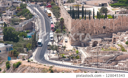 Close up view to Jerusalem timelapse with traffic on the road from the Mount of Olives. Close up view to Jerusalem timelapse with traffic on the road from the Mount of Olives. 128045343