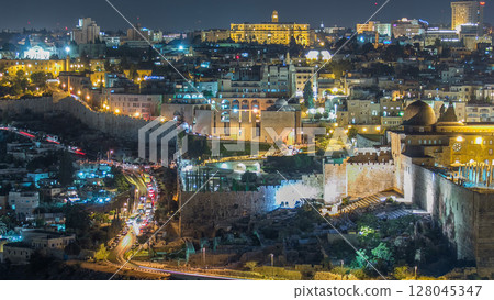 Close up view to Jerusalem night timelapse with traffic on the road from the Mount of Olives. Close up view to Jerusalem night timelapse with traffic on the road from the Mount of Olives. 128045347