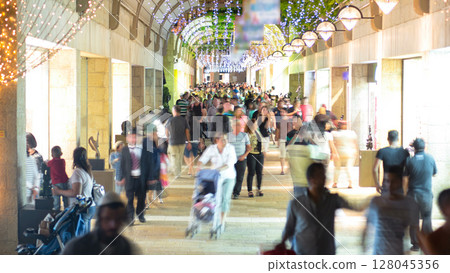 Shoppers and tourists at Mamilla shopping street timelapse in Jerusalem. 128045356