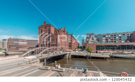 Panorama showing famous old Speicherstadt in Hamburg timelapse featuring the International Maritime Museum, Germany Panorama showing famous old Speicherstadt in Hamburg timelapse featuring the International Maritime Museum, Germany 128045432