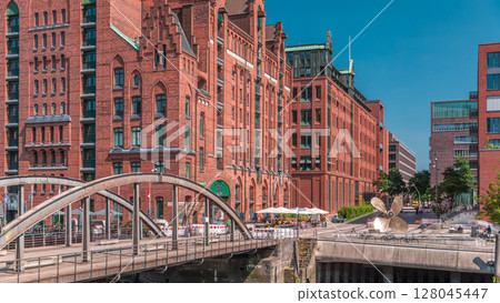 Famous old Speicherstadt in Hamburg timelapse featuring the International Maritime Museum, Germany Famous old Speicherstadt in Hamburg timelapse featuring the International Maritime Museum, Germany 128045447