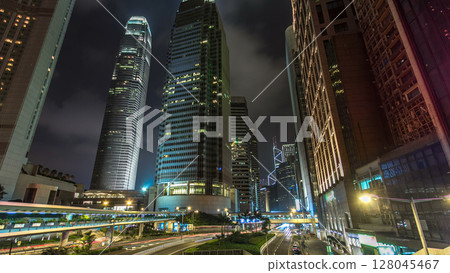 Hong Kong Business District with busy traffic timelapse at night. Hong Kong Business District with busy traffic timelapse at night. 128045467