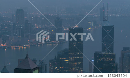 The famous view of Hong Kong from Victoria Peak night to day timelapse. 128045504