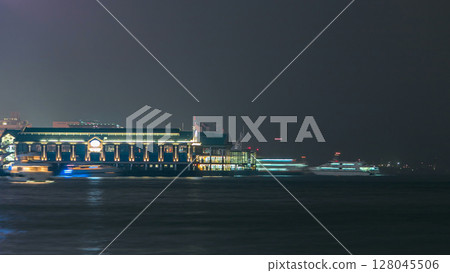 Ferry boat harbor in downtown Hong Kong night timelapse. 128045506