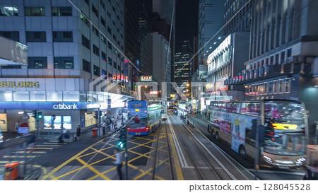 View from double-decker tram on street of HK timelapse hyperlapse. 128045528