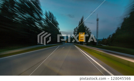 Asphalt road in Austria, Alps in a beautiful autumn day timelapse hyperlapse drivelapse 128045566