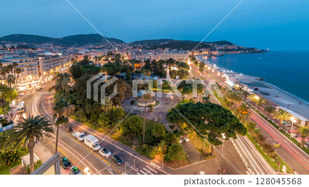 Evening aerial panorama of Nice day to night timelapse, France. Lighted Old Town little streets and waterfront after sunset 128045568