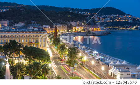 Evening aerial panorama of Nice day to night timelapse, France. Lighted Old Town little streets and waterfront after sunset Evening aerial panorama of Nice day to night timelapse, France. Lighted Old Town little streets and waterfront after sunset 128045570
