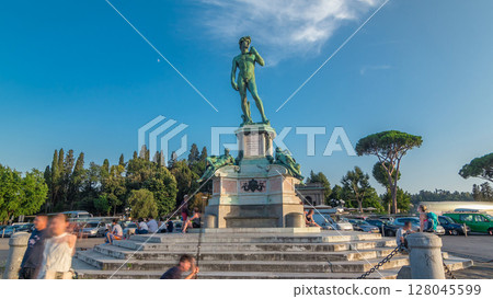 Bronze copy of the statue of David by Michelangelo at Piazzale Michelangelo timelapse hyperlapse in Florence 128045599