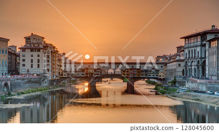 Sunset view of Florence Ponte Vecchio over Arno River in Florence timelapse, Italy. 128045600