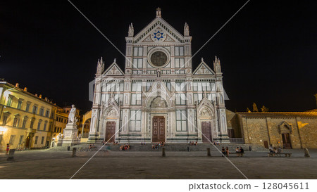 Tourists on Piazza di Santa Croce at night timelapse hyperlapse with Basilica di Santa Croce Basilica of the Holy Cross in Florence city. Tourists on Piazza di Santa Croce at night timelapse hyperlapse with Basilica di Santa Croce Basilica of the Holy Cross in Florence city. 128045611